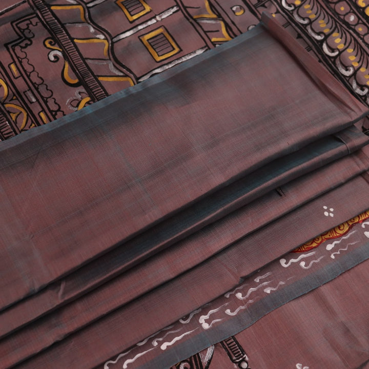 Close-up of multicolored Patachitra silk saree fabric texture showing hand-painted details.