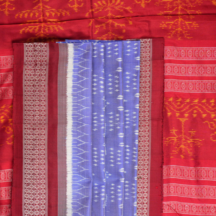 Close-up of the luxurious silk texture of the violet and maroon Sambalpuri Saree fabric.