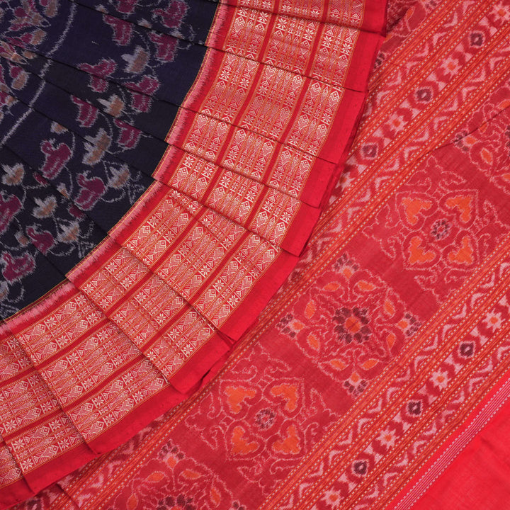 Full layout of a blue and red Sambalpuri cotton saree showcasing the complete pattern and border design.