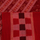 A full-length view of a vibrant blue Sambalpuri cotton saree with Pasapalli pattern and a contrasting red border.