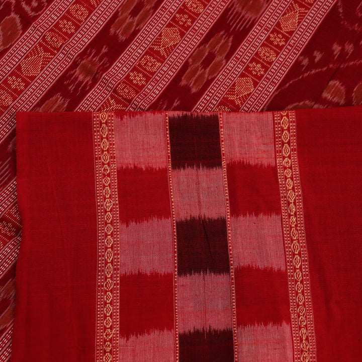 A full-length view of a vibrant blue Sambalpuri cotton saree with Pasapalli pattern and a contrasting red border.