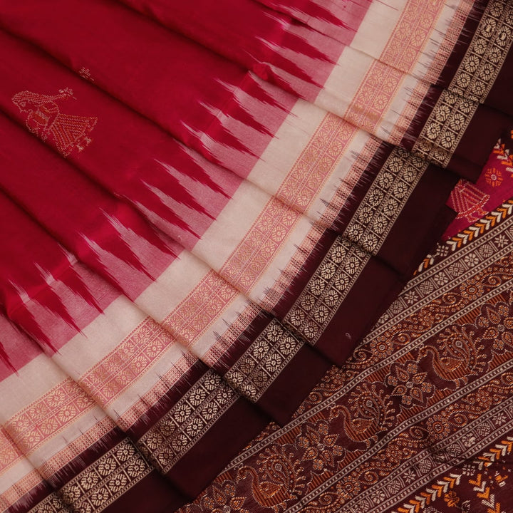 Close-up view of the woven fabric texture, showcasing the intricate butta patterns on the white silk body.