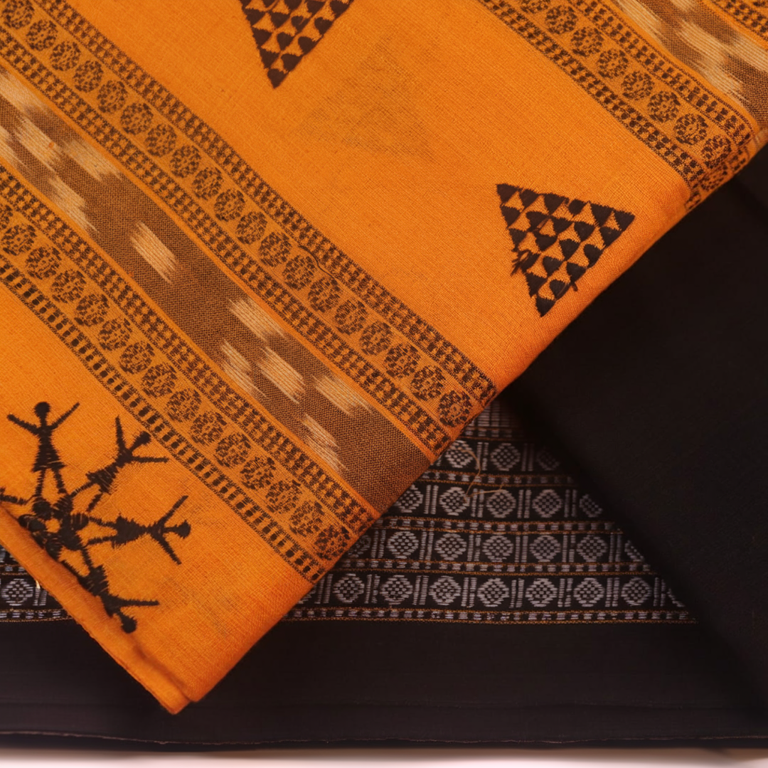 Close-up of yellow and black Sambalpuri cotton dress material blouse piece with motifs.