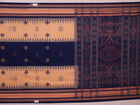 Cream cotton Bomkai saree with blue butta pattern, full view.