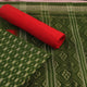 Close-up of the green Sambalpuri cotton dress material's blouse piece with red motifs.
