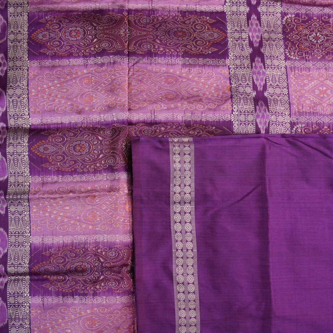 Close-up of purple Bomkai Silk Saree fabric, revealing its luxurious silk texture and exquisite handloom weave.