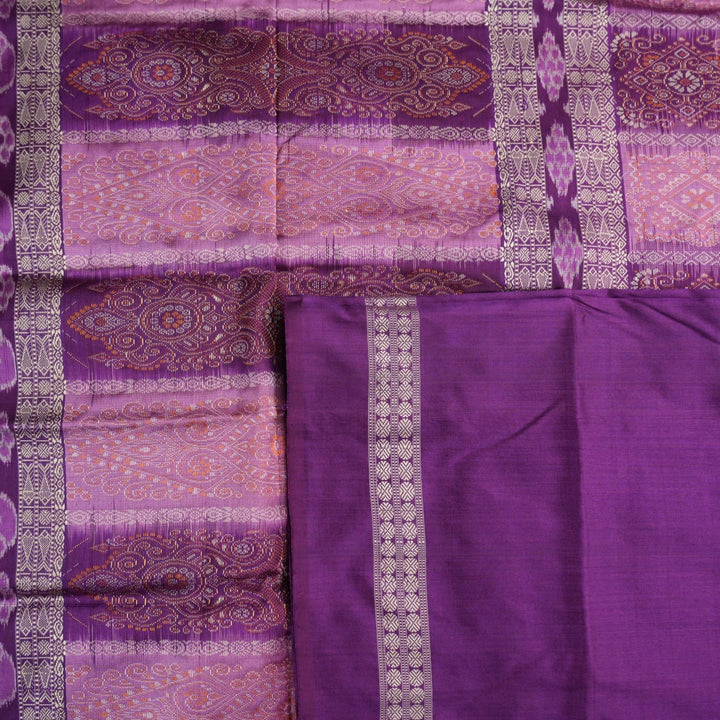 Close-up of purple Bomkai Silk Saree fabric, revealing its luxurious silk texture and exquisite handloom weave.