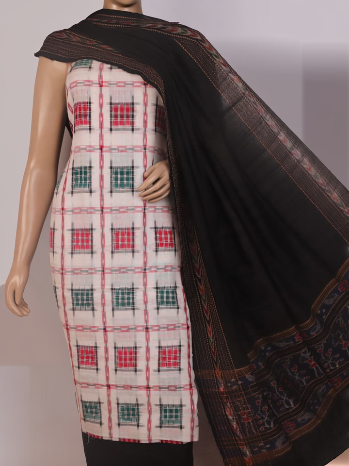 Detail of the motif-patterned blouse piece from a white and black Sambalpuri cotton dress material.