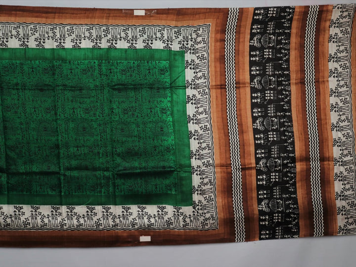 Full view of a green and brown Tussar silk saree featuring traditional motifs throughout the body.