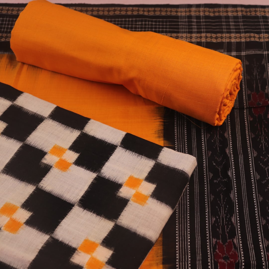 Detail of the white and yellow Sambalpuri cotton dress material blouse piece, showing motifs.