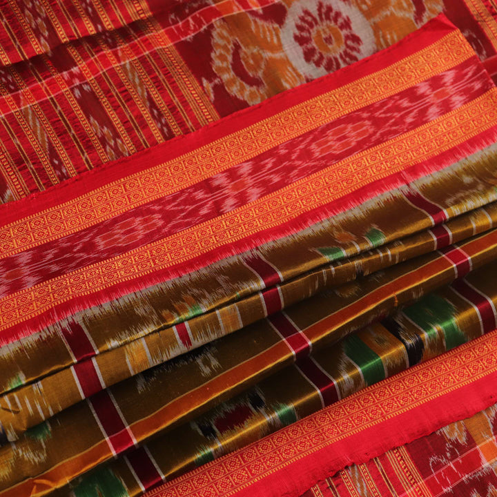 Green Khandua silk saree styled and draped to showcase the Nabakothi pattern, a traditional handloom saree.