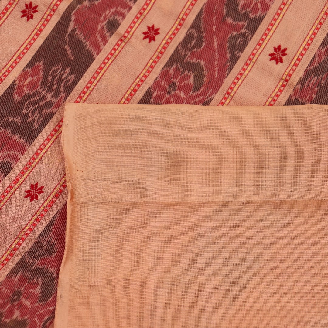 Full body view of a vibrant red cotton Sambalpuri saree featuring intricate butta patterns and a cream border.