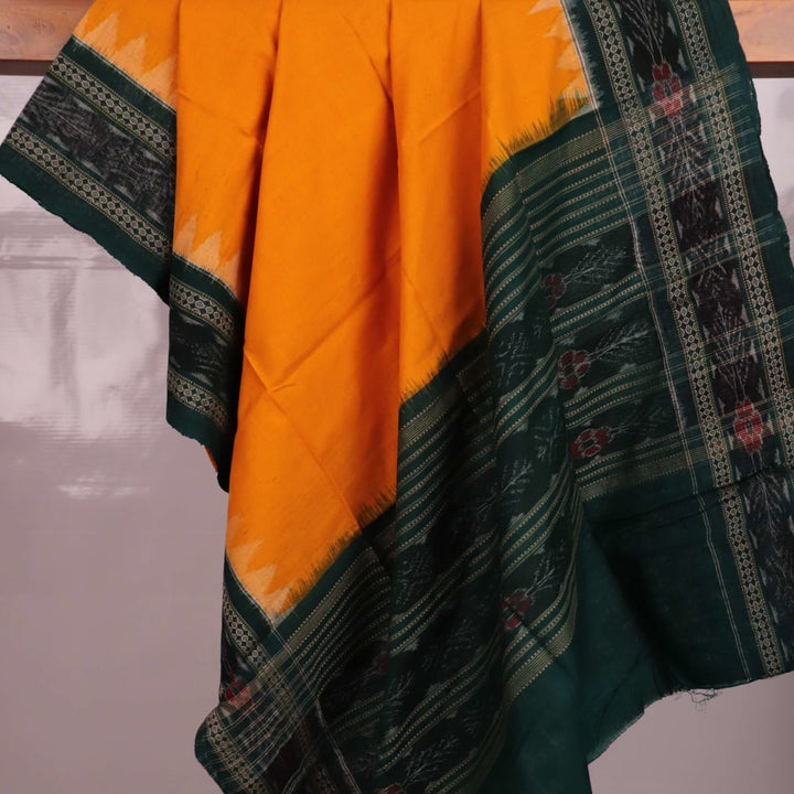 Yellow Sambalpuri cotton dupatta styled with a green blouse piece, draped over a model