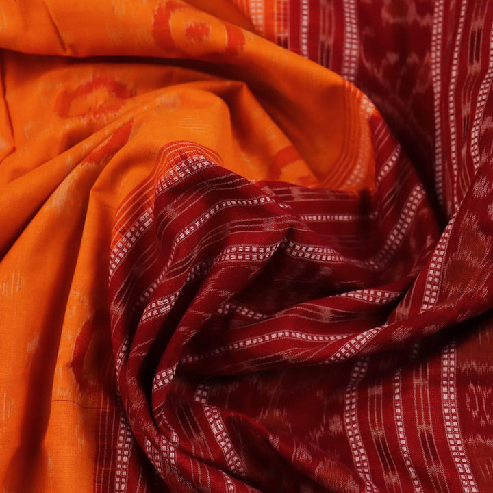 Full view of a vibrant yellow cotton Sambalpuri saree with maroon motifs and intricate border design