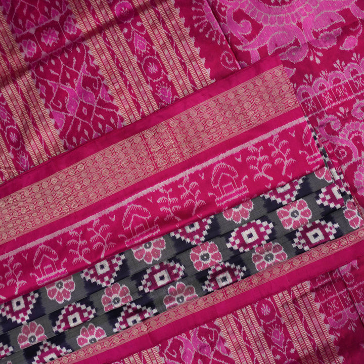 Detail of the luxurious silk texture and exquisite handloom weave of the Multi-color Pink Sambalpuri Saree.