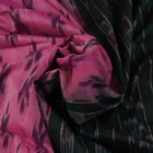 Pink and green Sambalpuri cotton saree with motifs, elegantly draped on a model.