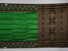 Model draped in a green and black Khandua silk saree with butta work, showcasing elegant ethnic styling.