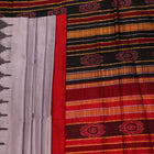 Close-up of grey and red Sambalpuri Silk saree fabric texture, highlighting butta pattern weave.
