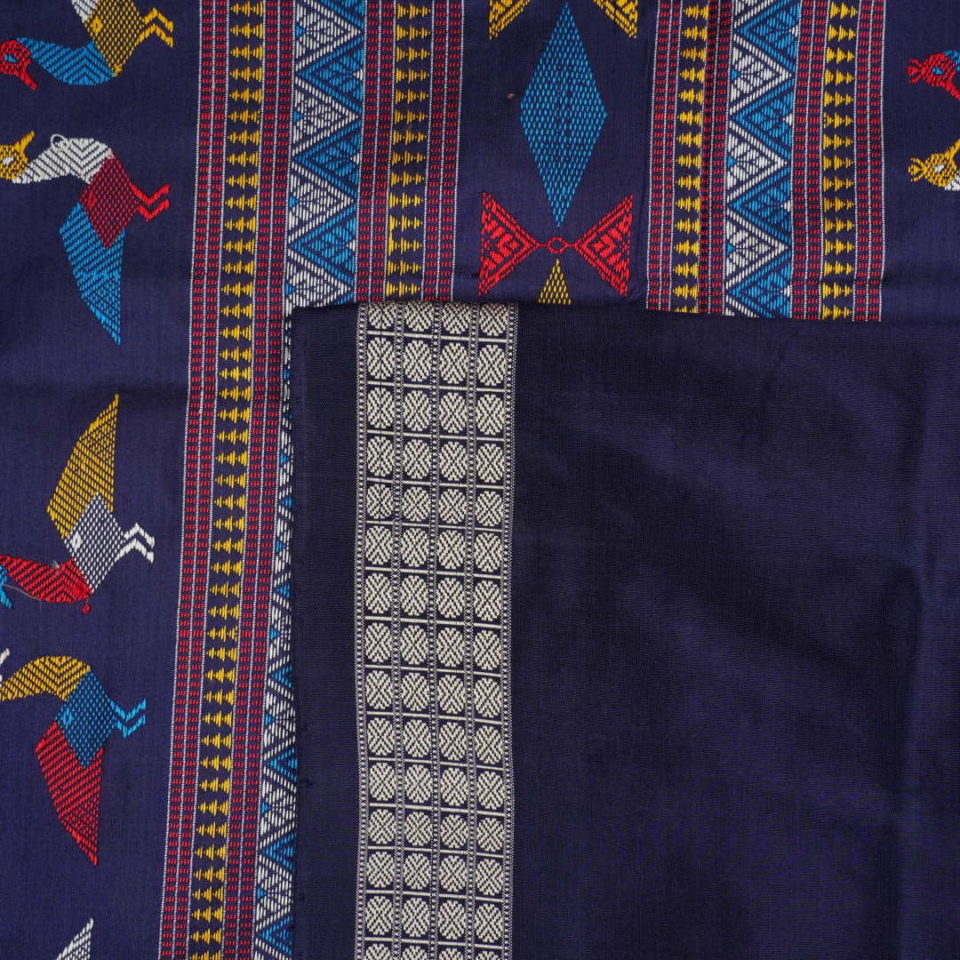 Extreme close-up revealing the rich texture and intricate weave of green Bomkai Silk fabric.