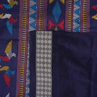 Extreme close-up revealing the rich texture and intricate weave of green Bomkai Silk fabric.