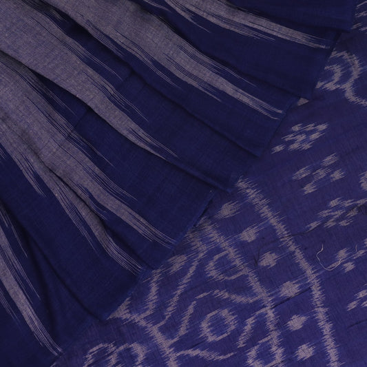 Blue plain Sambalpuri cotton saree styled, highlighting its simple elegance and drape.