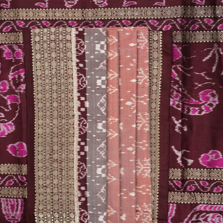 Close-up of the rich multi-color and maroon Sambalpuri silk fabric, highlighting its exquisite handloom weave texture.