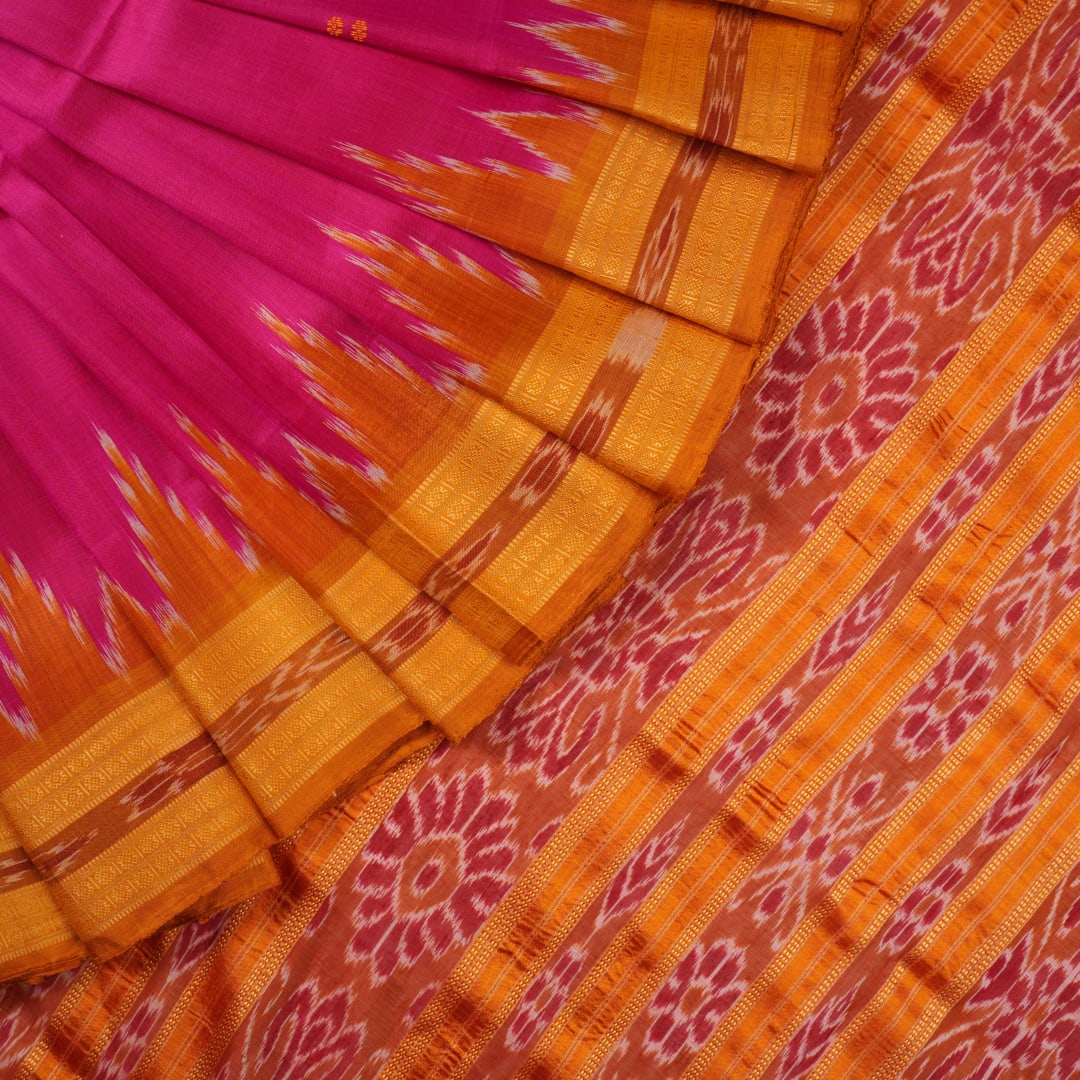 Model wearing a pink and yellow Khandua silk saree with butta work, styled in a traditional drape.