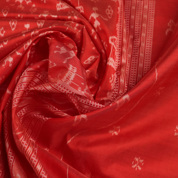 Close-up showcasing the intricately woven silk fabric texture of a multi-colored Sambalpuri saree with traditional motifs.