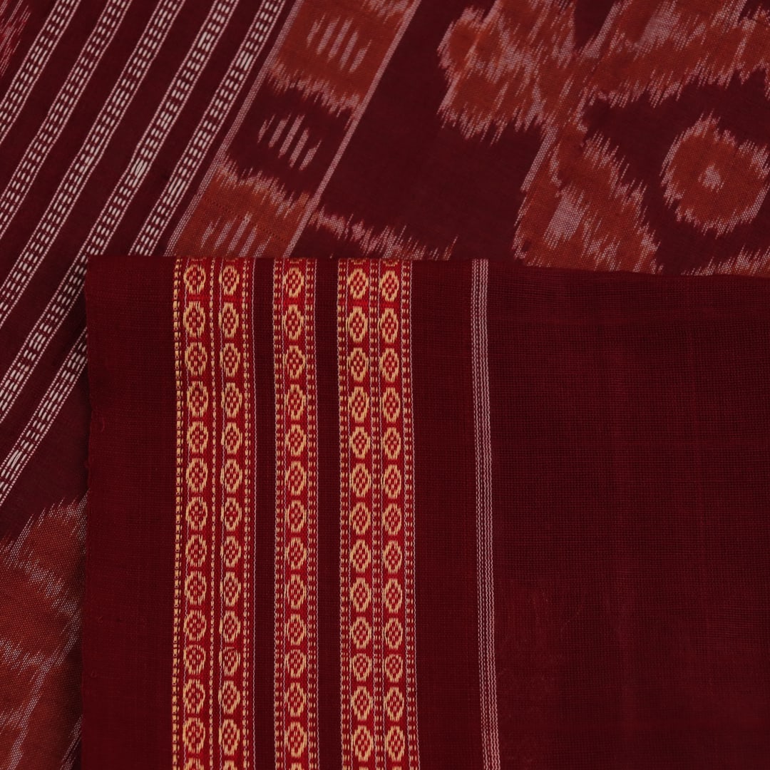 Full view of a traditional green and maroon cotton Bomkai saree featuring a butta pattern.