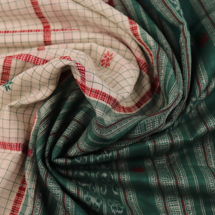 Full view of a white cotton Sambalpuri saree with green butta patterns.