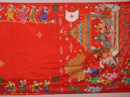 Close-up of red Patachitra silk saree fabric showing hand-painted texture.