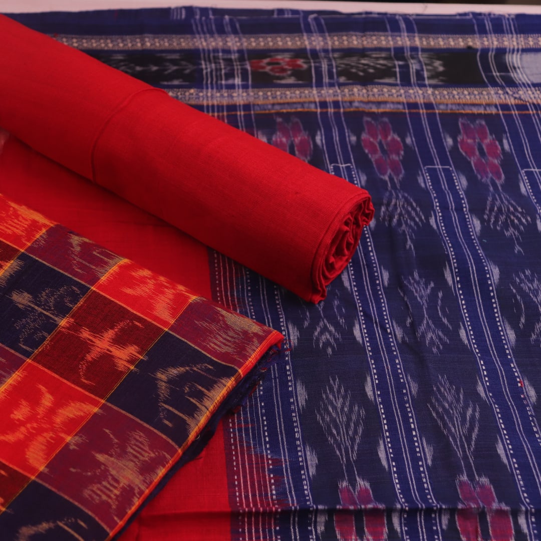 Detail of the red Sambalpuri cotton dress material's blouse piece with motifs.
