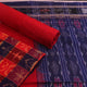 Detail of the red Sambalpuri cotton dress material's blouse piece with motifs.