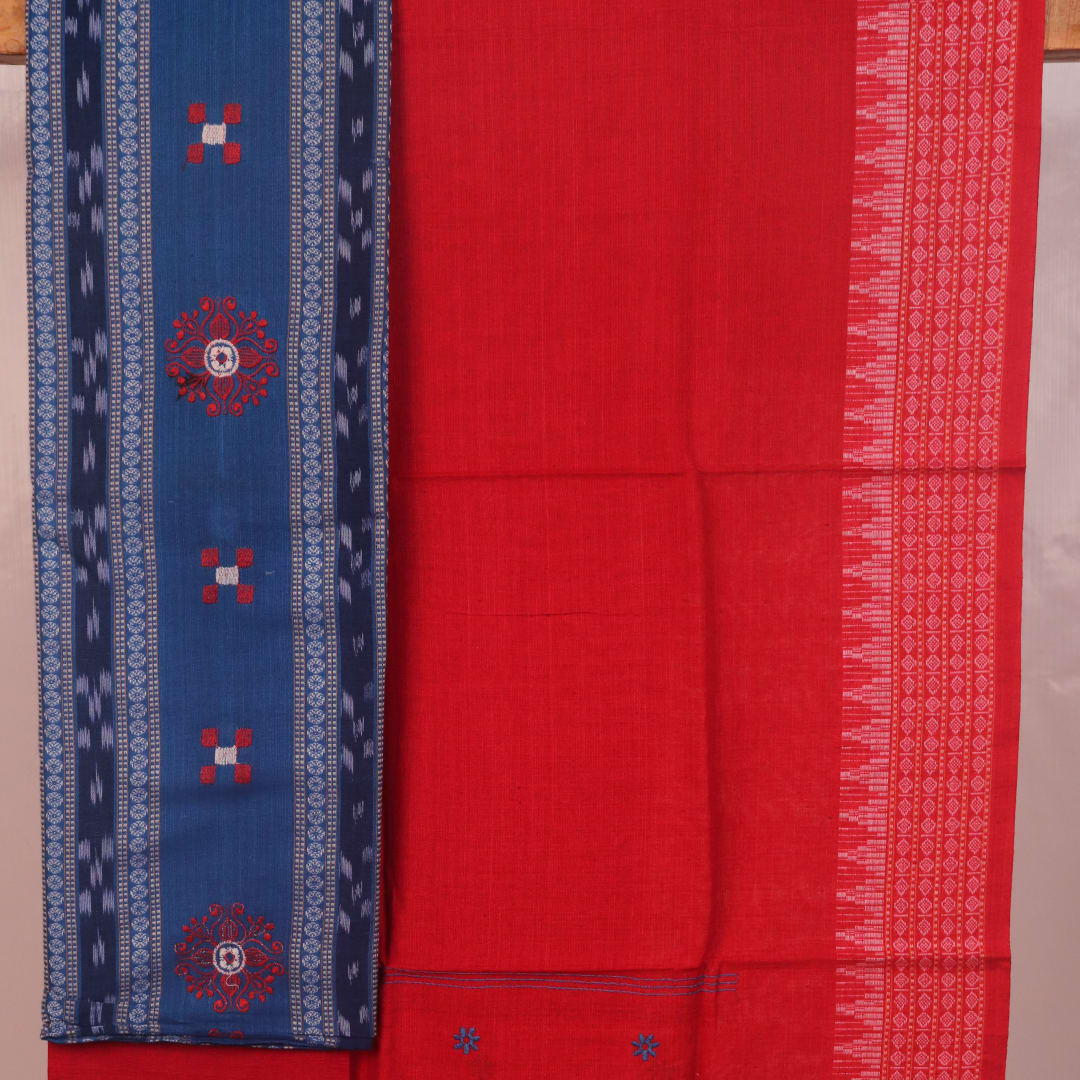 Sambalpuri cotton dress material: Close-up of blue blouse piece with red motifs.