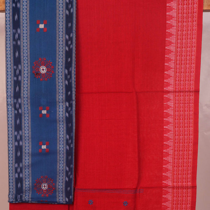 Sambalpuri cotton dress material: Close-up of blue blouse piece with red motifs.