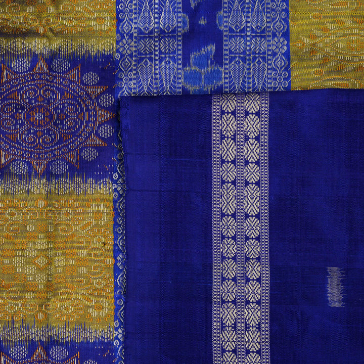 Detailed close-up of the exquisite green Bomkai Silk Saree fabric, highlighting its luxurious silk weave.