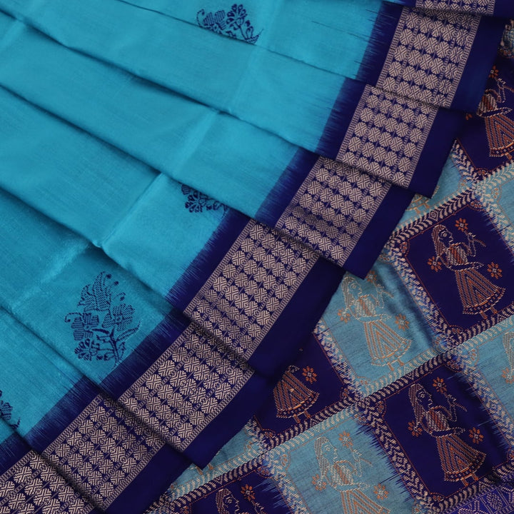 Close-up showcasing the silk texture of a blue and blue Bomkai silk saree with a butta pattern.