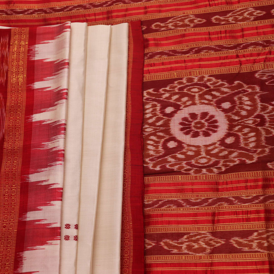 Khandua silk saree styled; white with red butta design, showcasing drape and overall look.