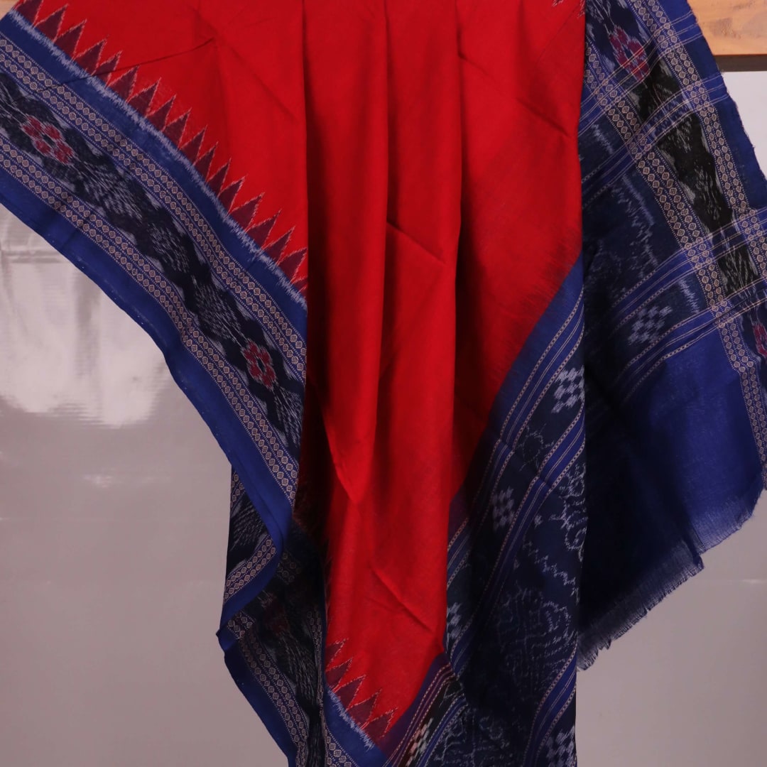 Styling view of a red and blue Sambalpuri cotton dupatta with plain pattern and tassels