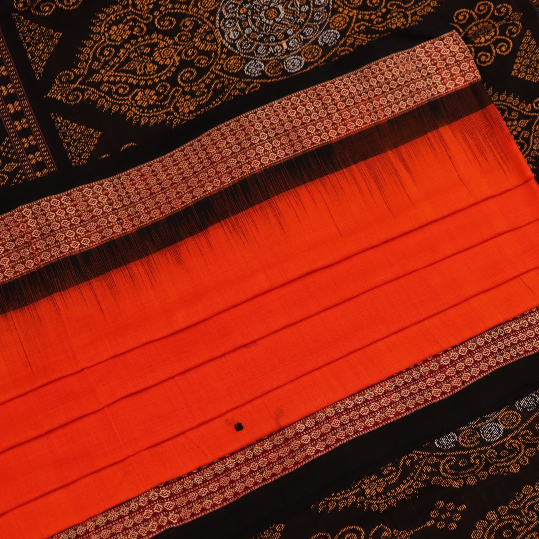 Full view of a Bomkai cotton saree in orange with black butta pattern