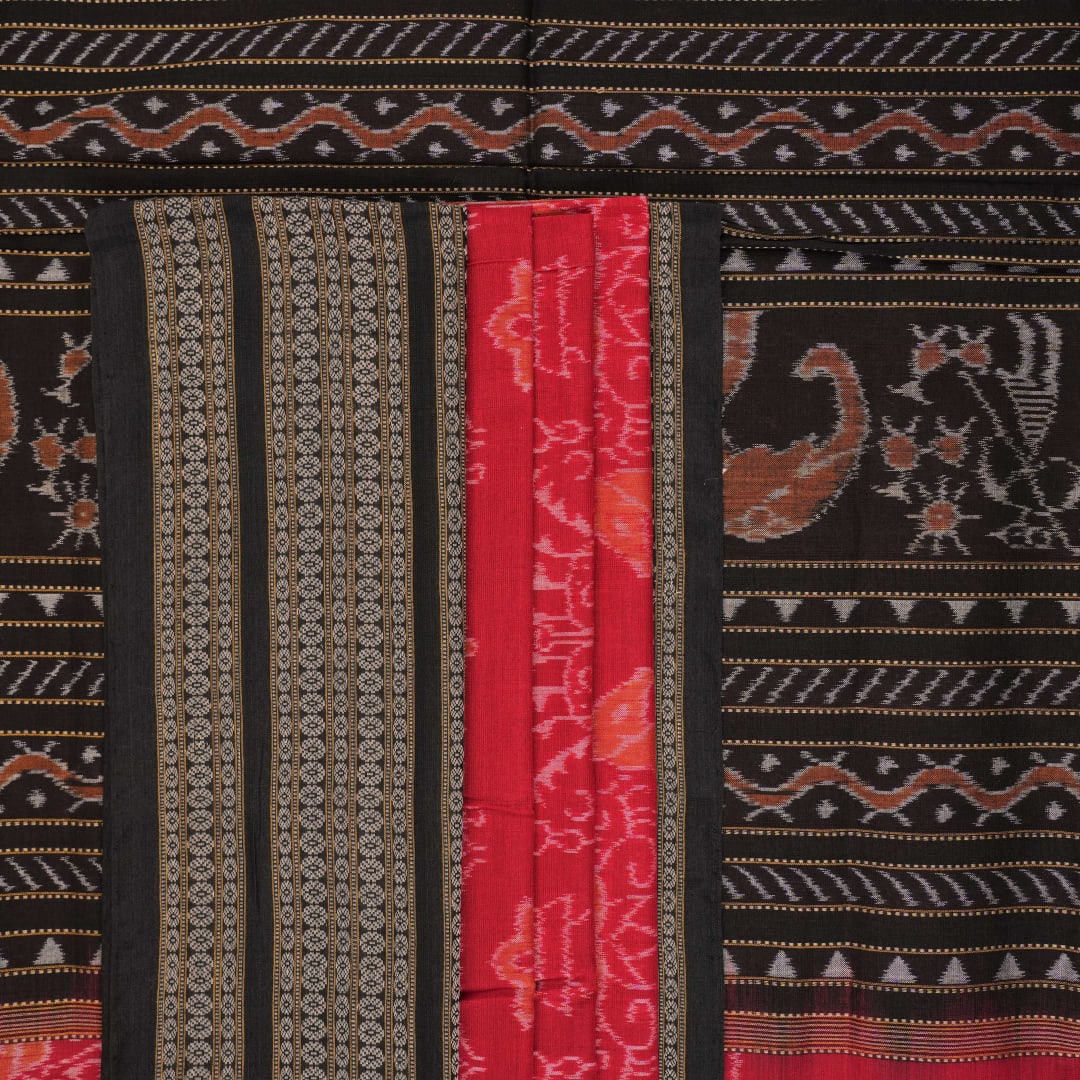 Flat layout view of the red and black Sambalpuri cotton saree showing the body, border, and pallu.