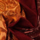 Yellow and maroon Sambalpuri cotton saree with motifs, draped elegantly to showcase its design.
