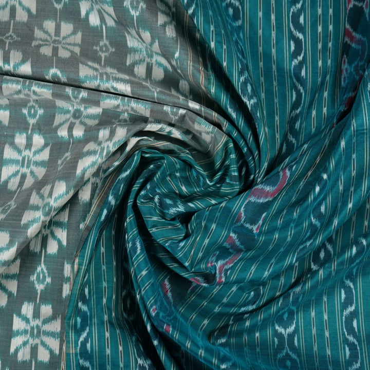 Close-up revealing the luxurious silk texture and subtle motif weave of the blue Sambalpuri saree.