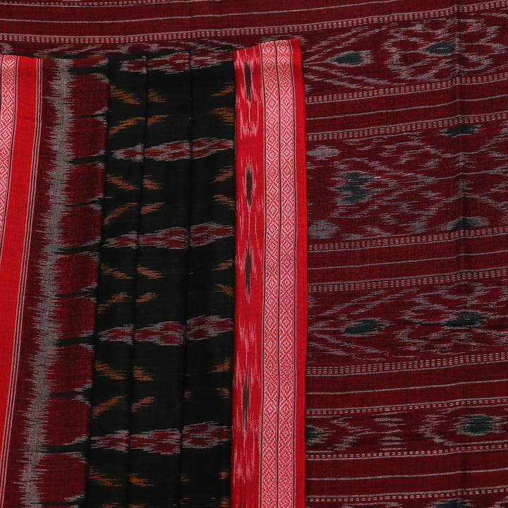 Black and red Sambalpuri cotton saree draped, showcasing its traditional motifs and elegant handloom texture.