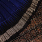 Close-up of the intricate woven texture of blue and black Bomkai silk saree with butta.