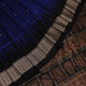Close-up of the intricate woven texture of blue and black Bomkai silk saree with butta.