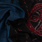 Draped plain blue and black Sambalpuri cotton saree.