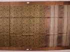 Close-up of printed multi-color handloom Tussar silk saree fabric texture.