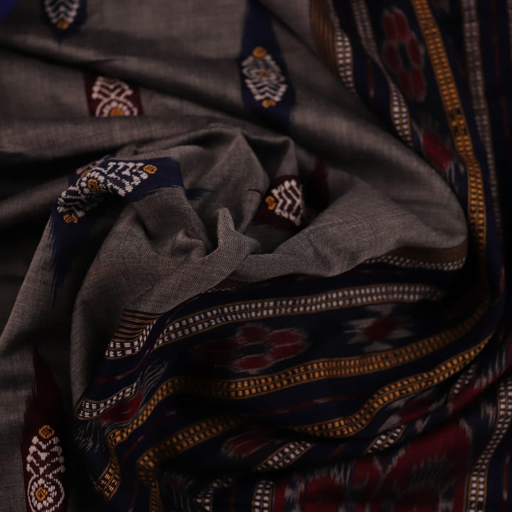 Full view of the grey cotton Bomkai saree with blue butta patterns