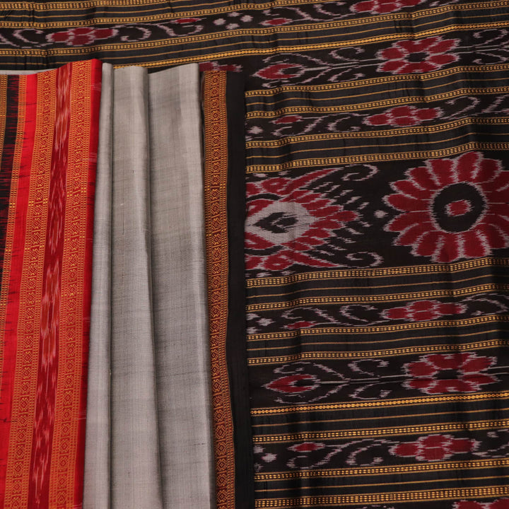 Saree draped: Grey Khandua silk saree with black butta pattern, showcasing elegant styling.